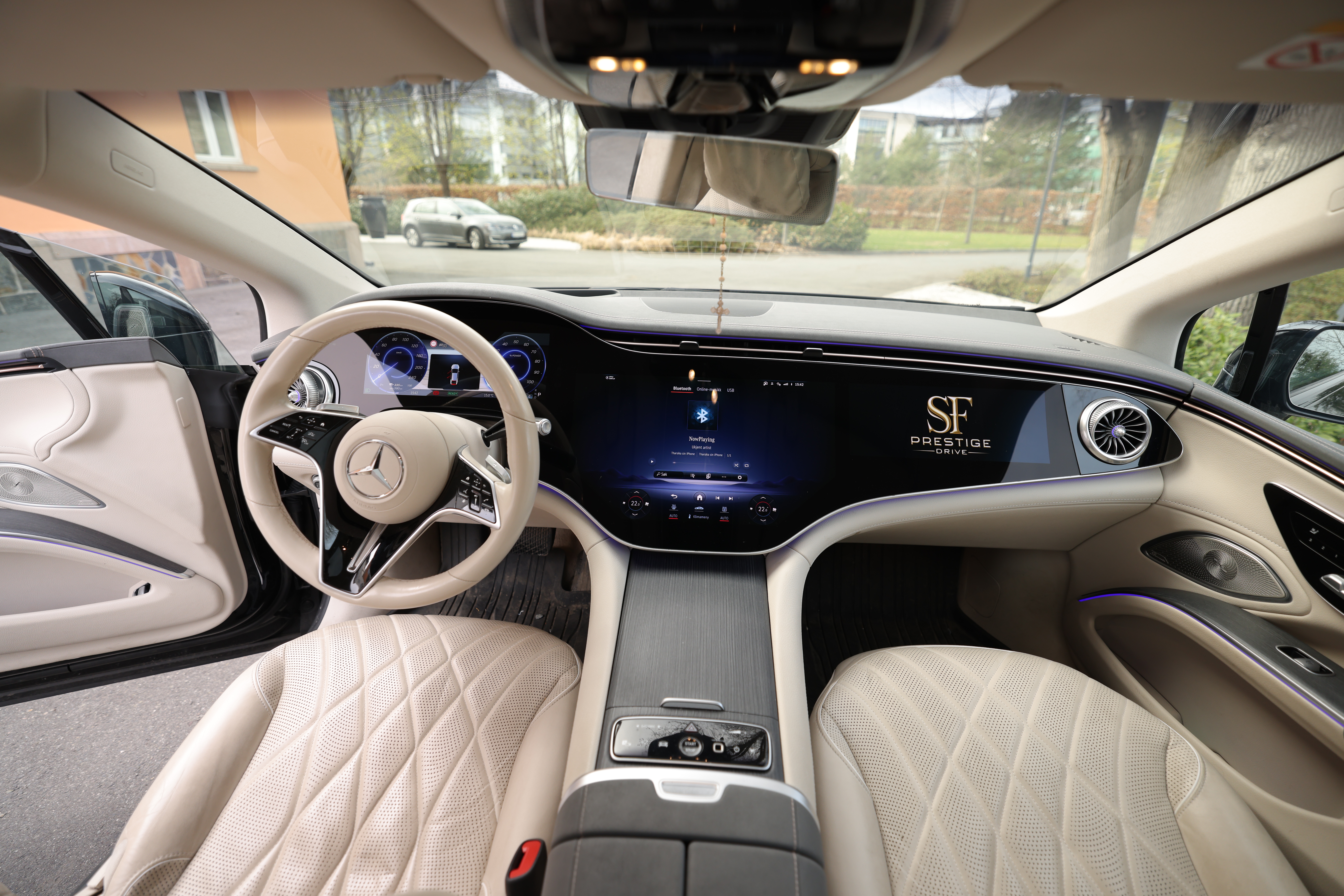 The rear cabin of a chauffeured Mercedes-Benz sedan